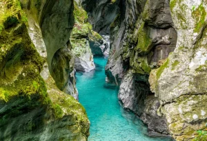 Breathtaking view of a turquoise stream in rocky Tolmin gorge in Slovenia