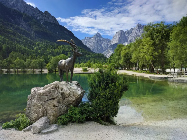 Lake Jasna and mountain goat statue in Kranjska Gora, Slovenia
